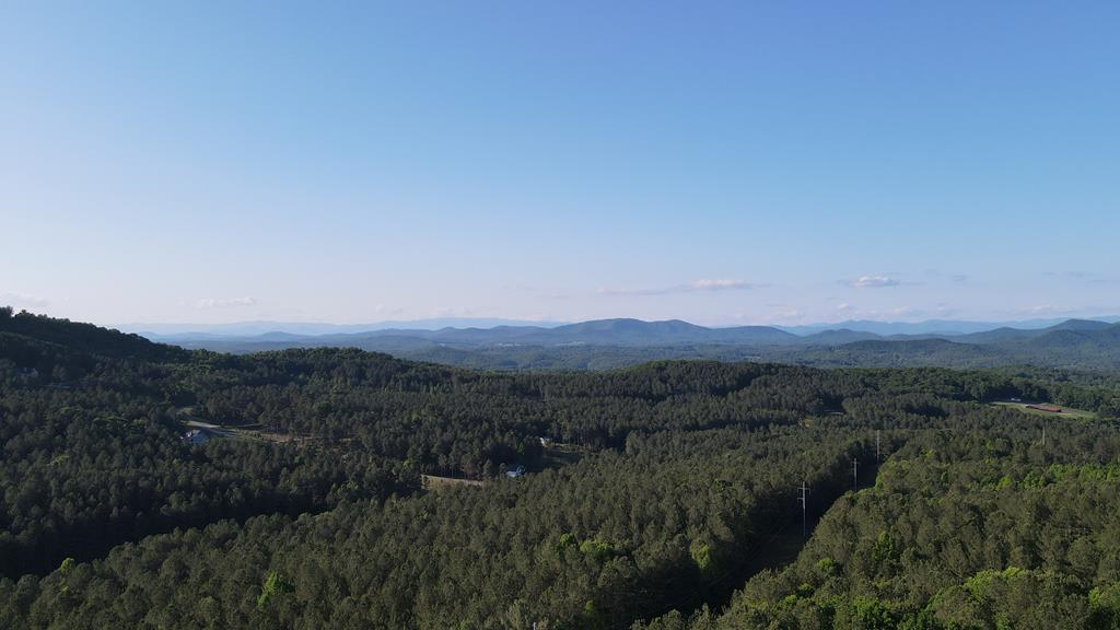 a view of a town with mountains in the background