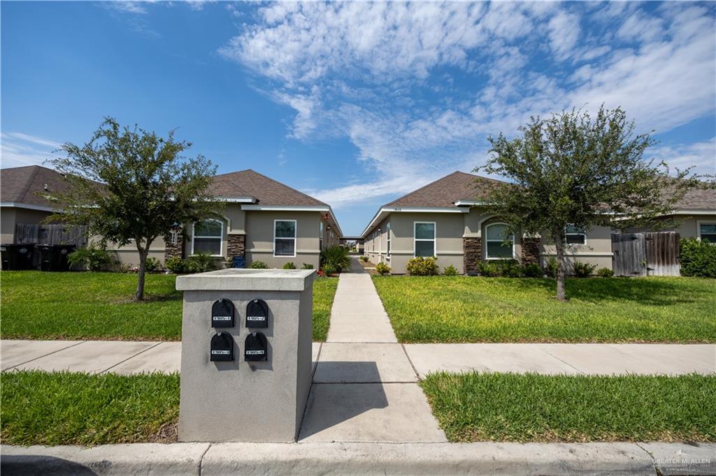 View of front of property with a front yard