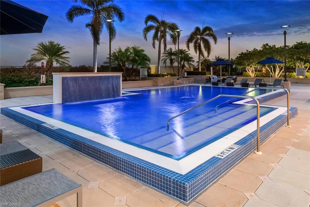 Rooftop Pool at dusk featuring a patio area