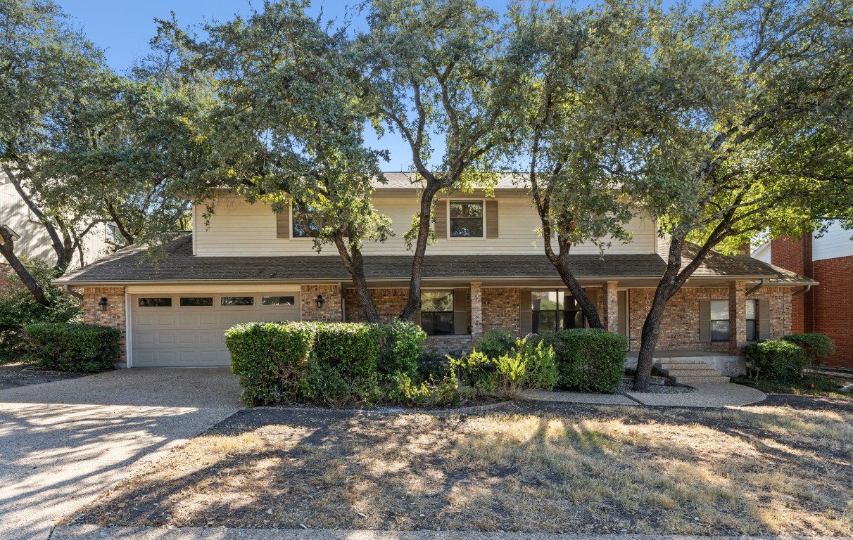 front view of a house with a trees