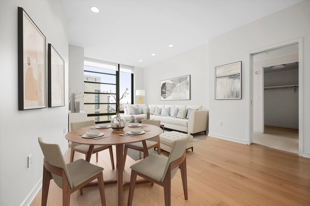 a view of a dining room with furniture and wooden floor