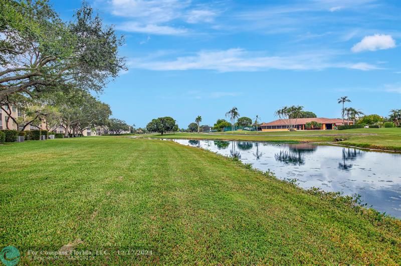 a view of a lake with a yard