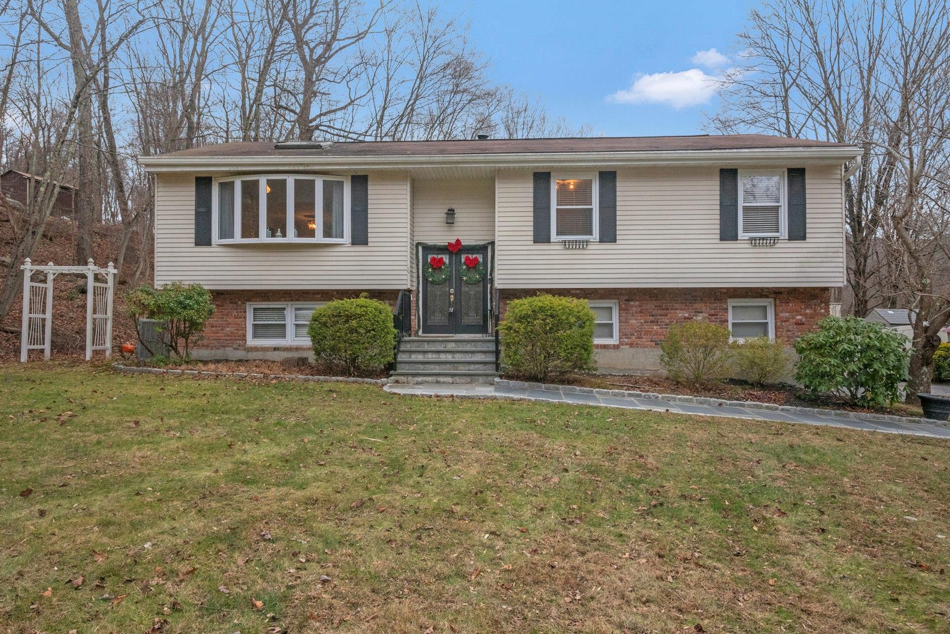 Beautiful home enhanced with new front walkway and stairs.