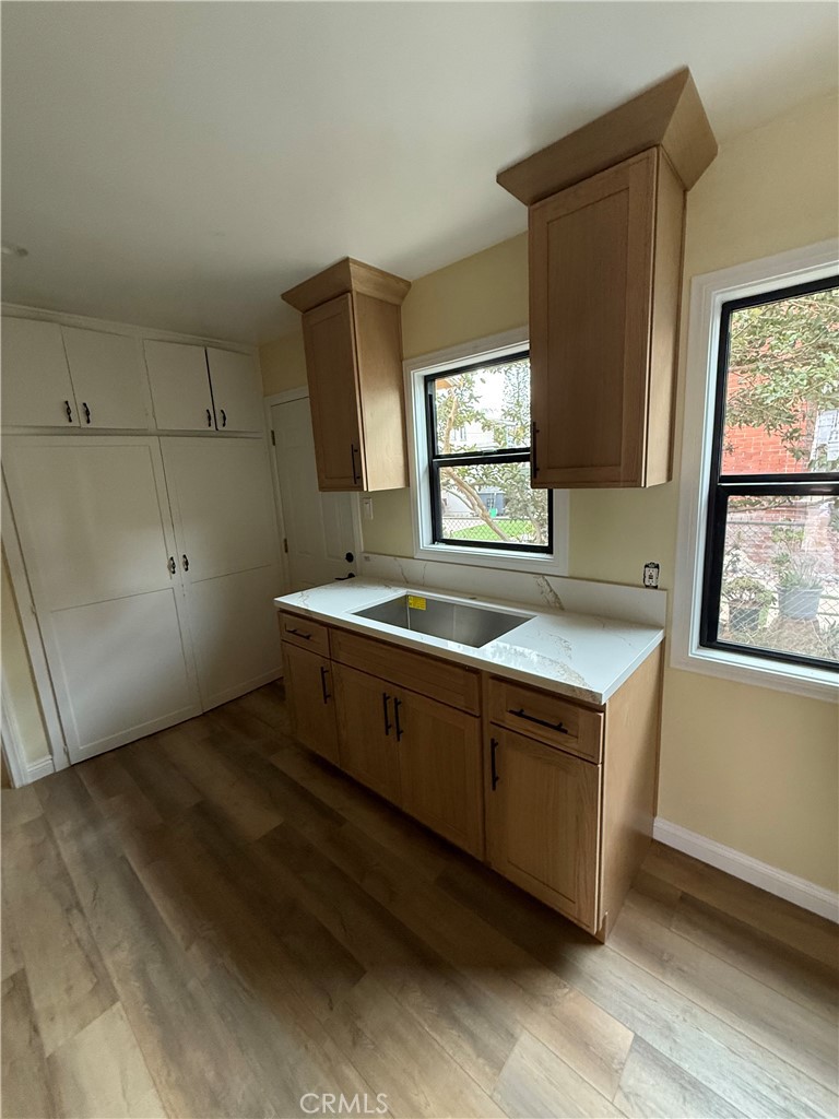 a room with a window and a sink