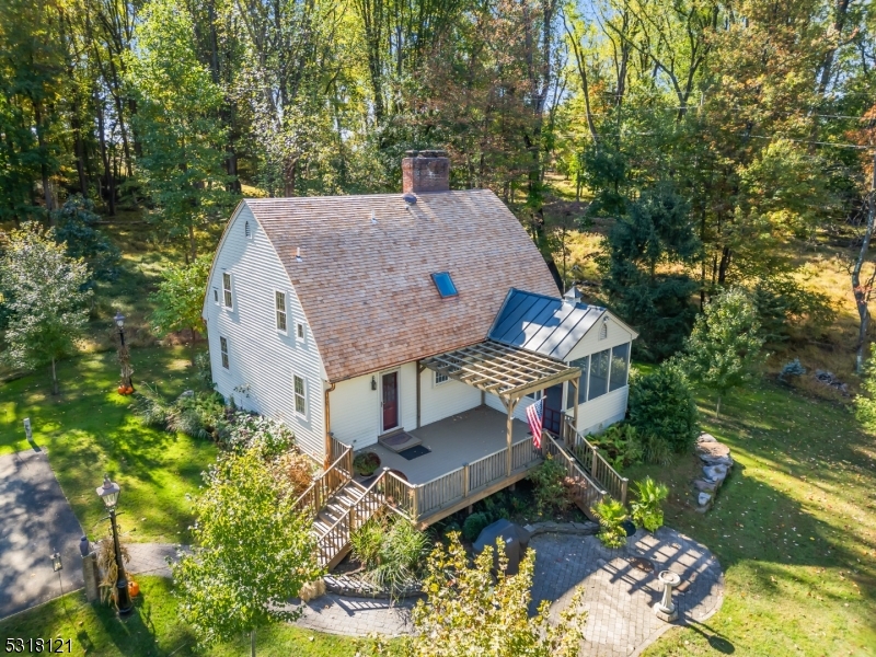 a aerial view of a house with a yard