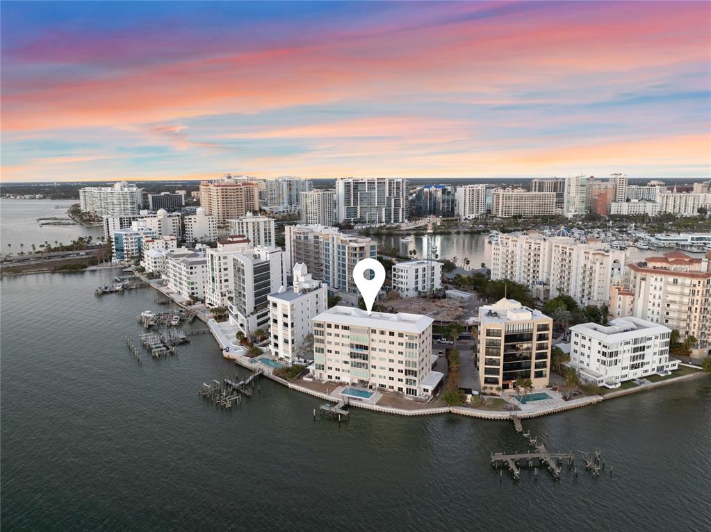 a view of a lake with tall buildings