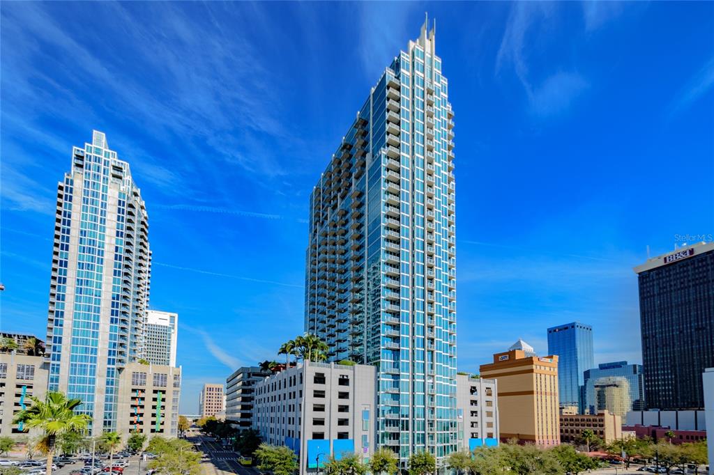 a view of a city with tall buildings