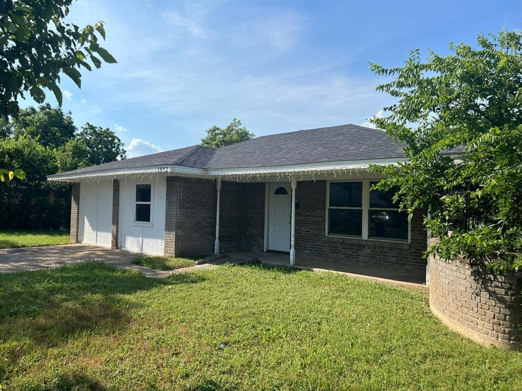 front view of a house with a yard