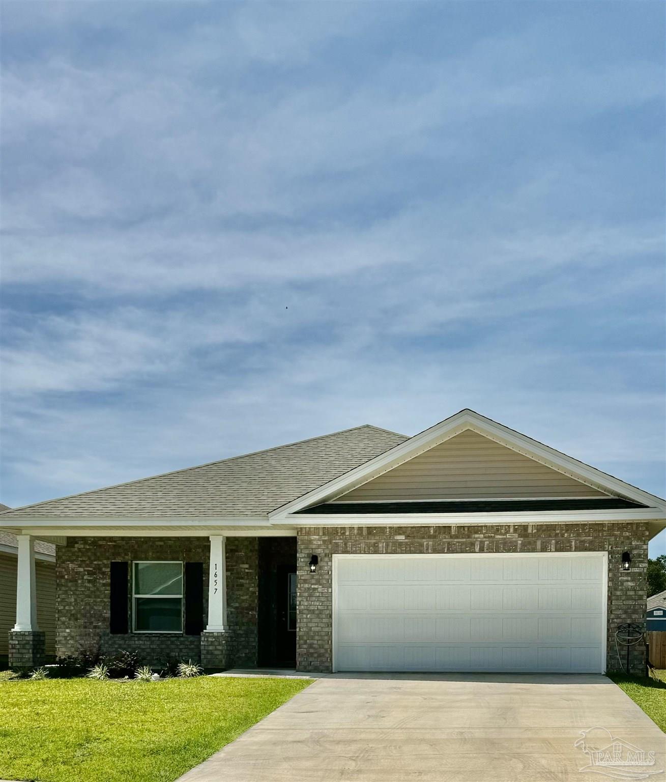 a front view of a house with yard