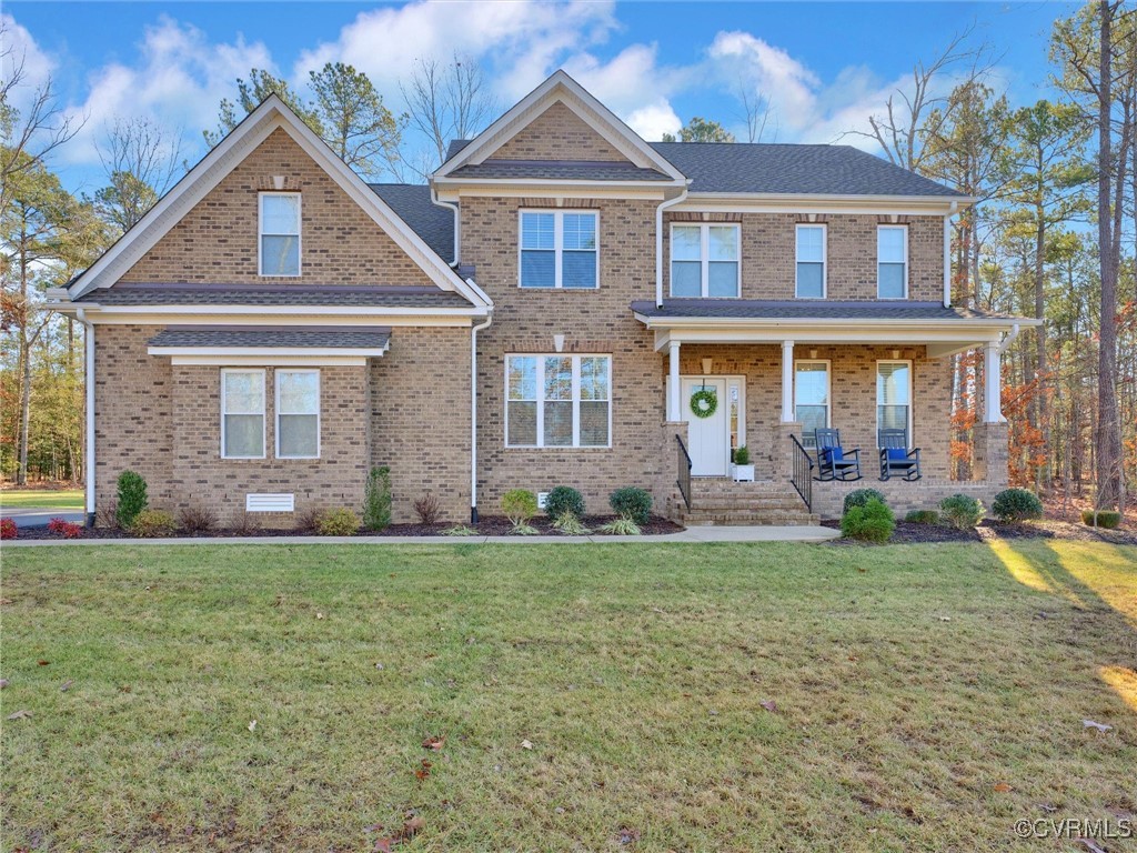 a front view of a house with a yard