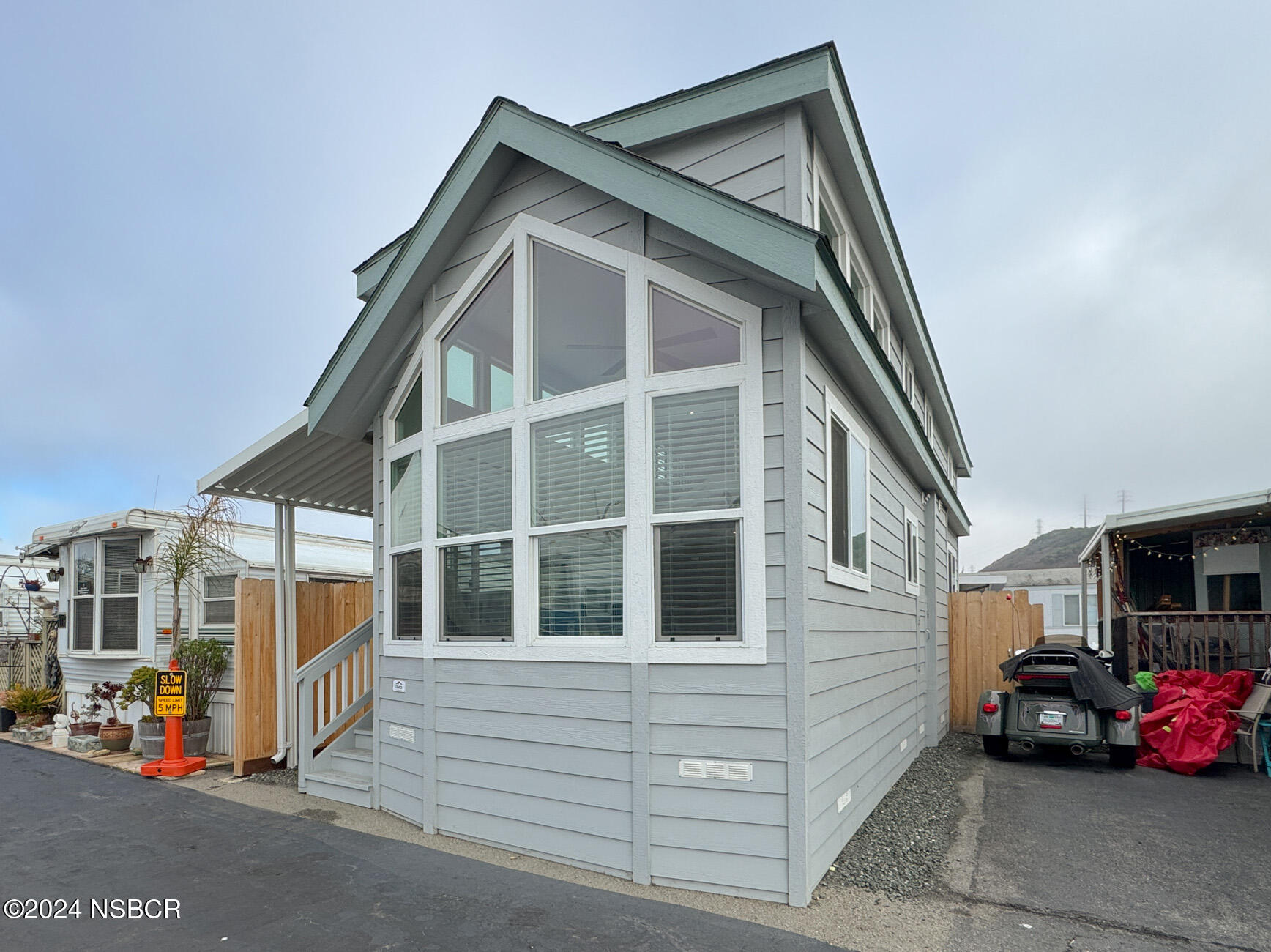 a view of a house with a parking space