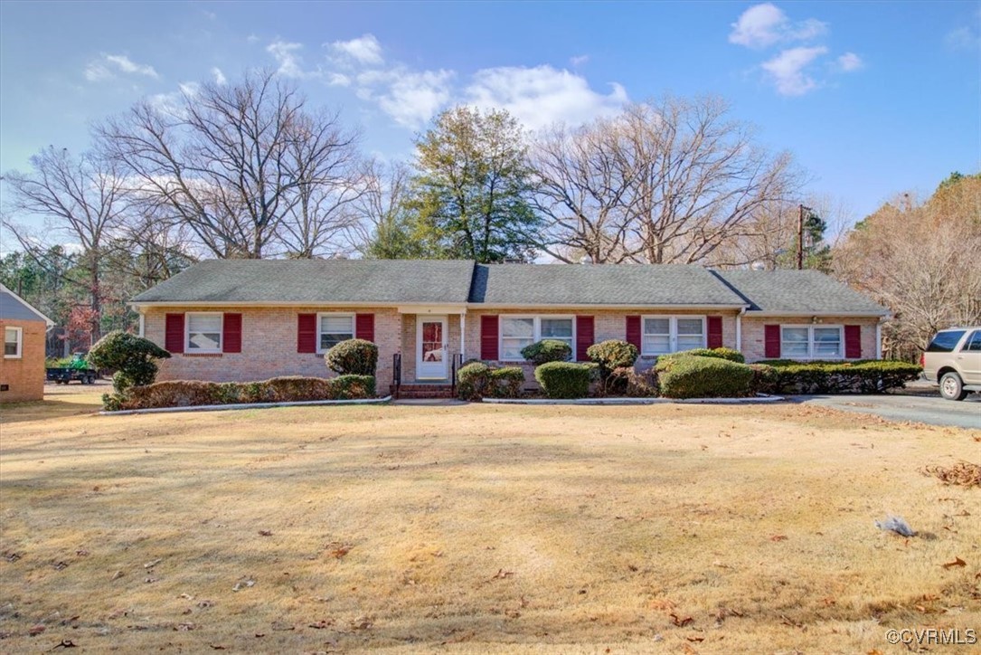 a front view of brick house with yard