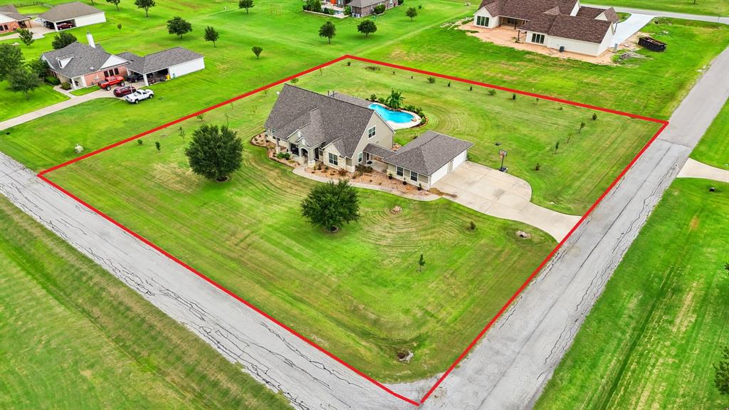 This aerial view showcases the HUGE 47,306 sqft corner lot.