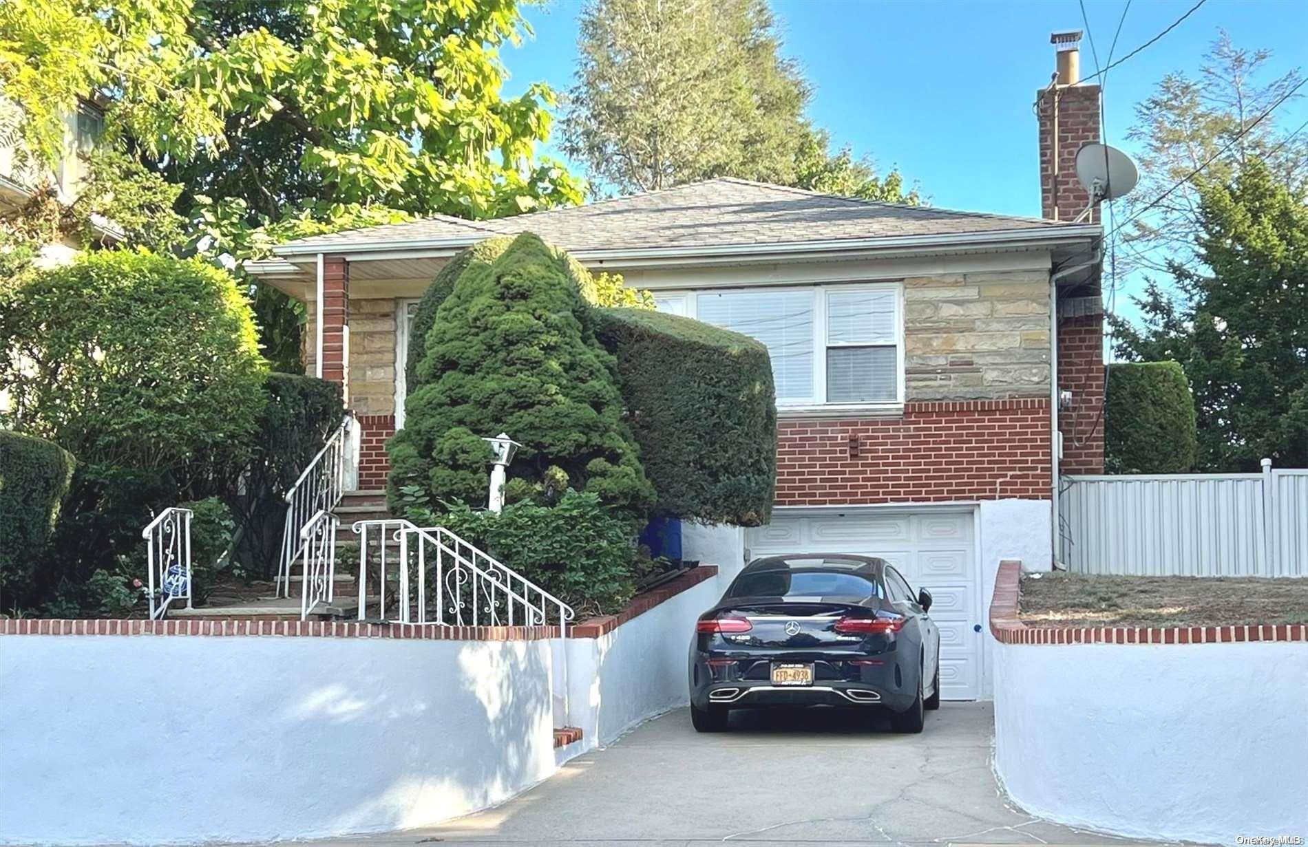 a view of a car parked in front of a house