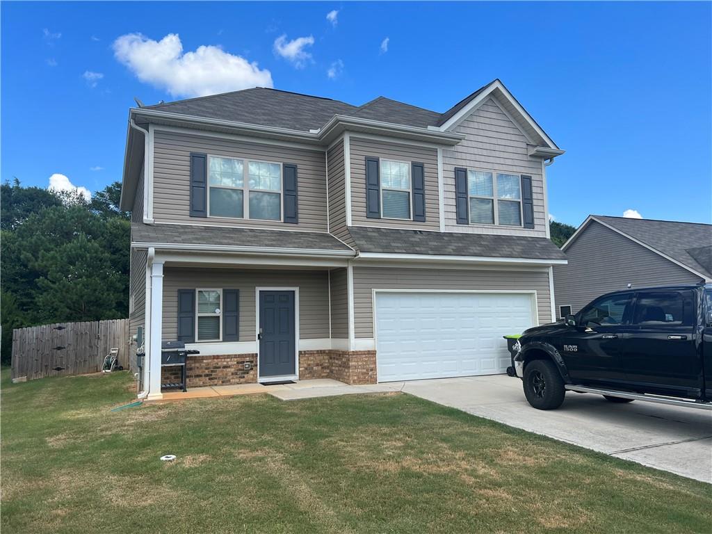 a front view of a house with garage