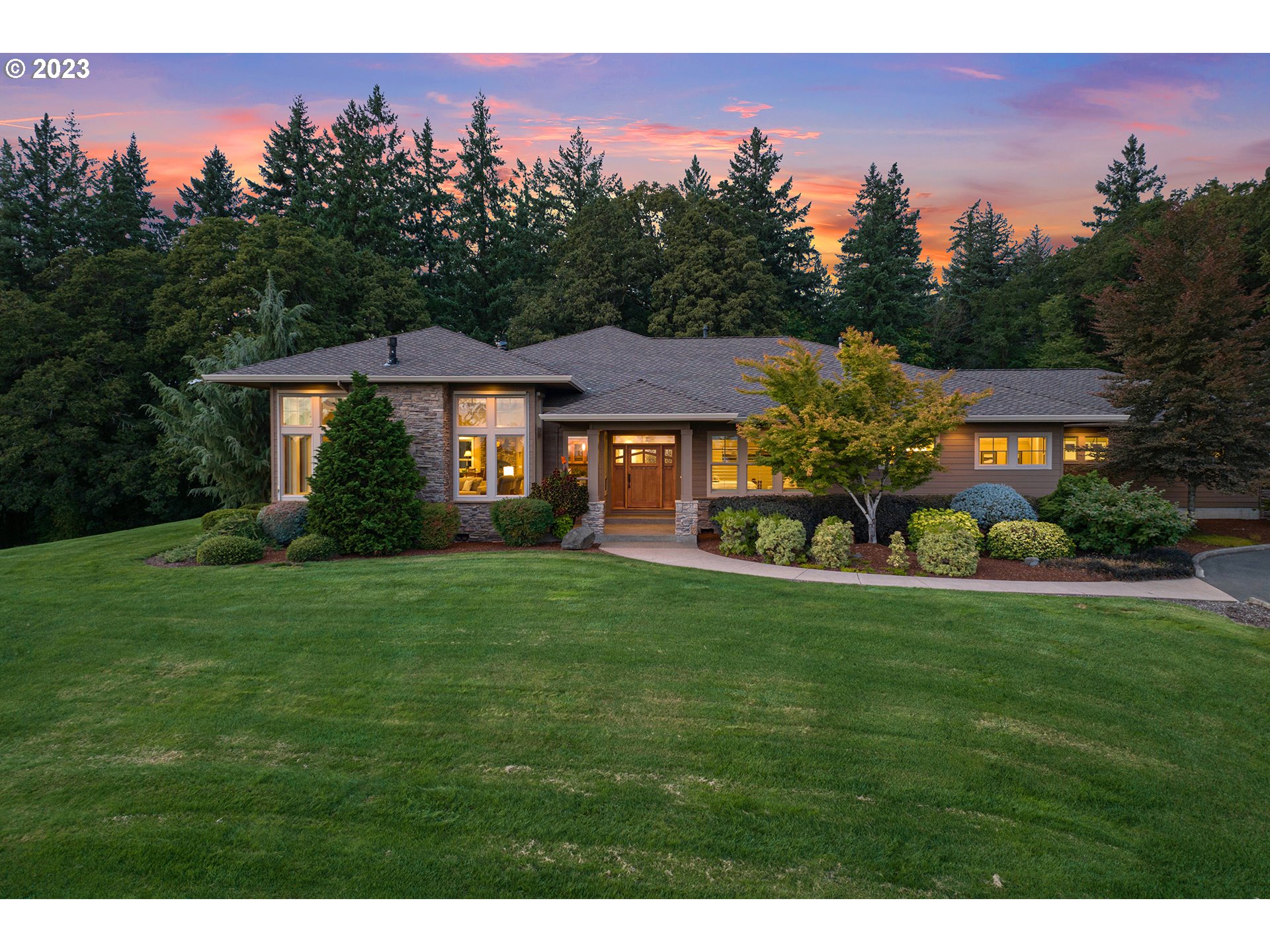 a front view of a house with a yard