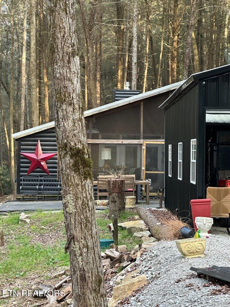 Front of main cabin with 2 car garage