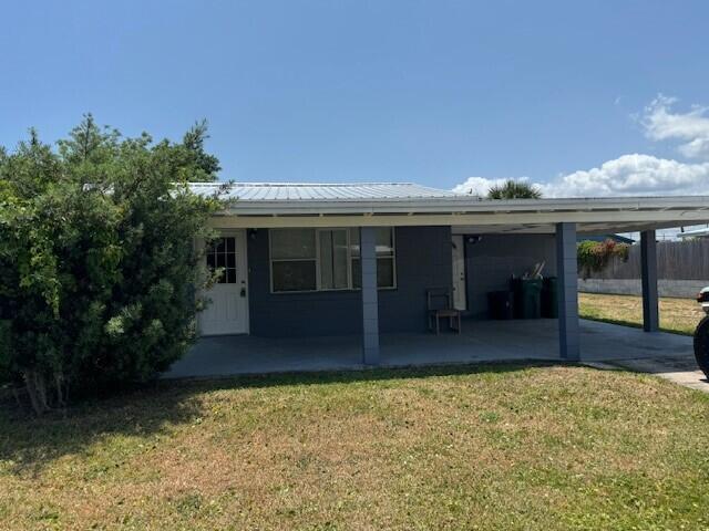 a front view of house with yard and outdoor seating