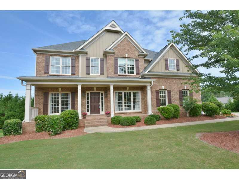 a front view of a house with a yard