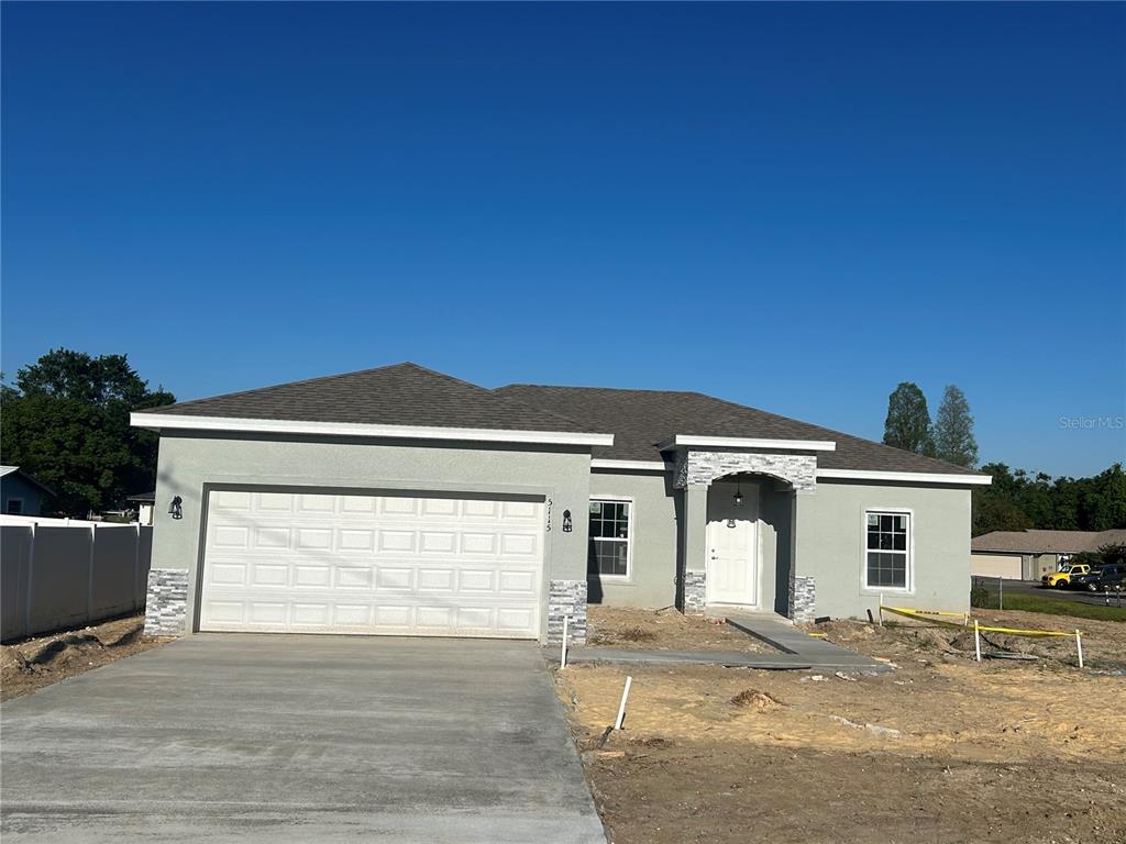 a front view of a house with a garage