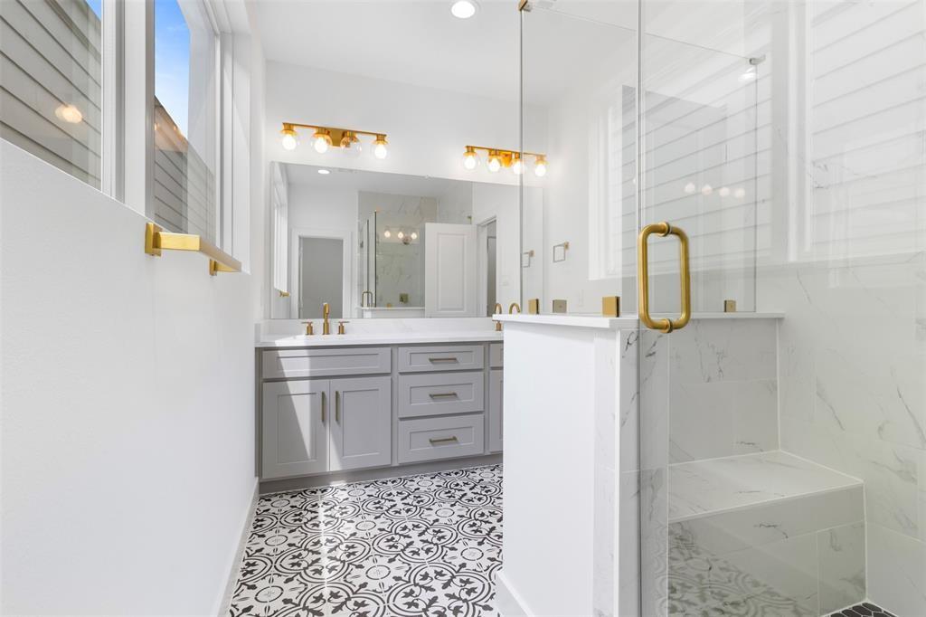 a bathroom with a sink a vanity and a mirror