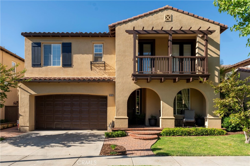 a front view of a house with yard