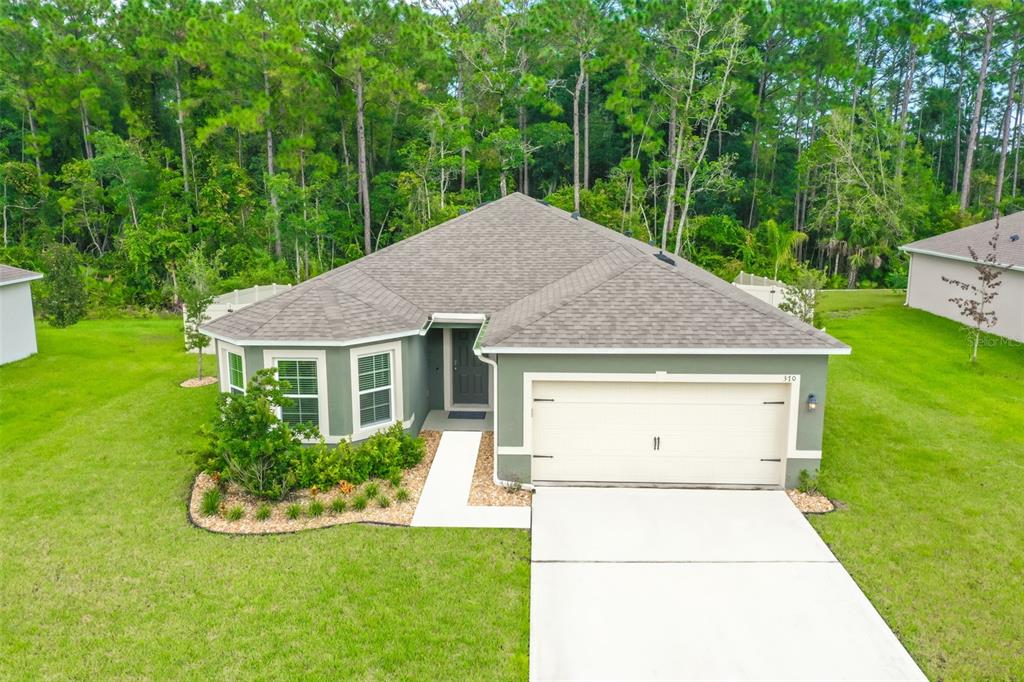 a house view with a garden space