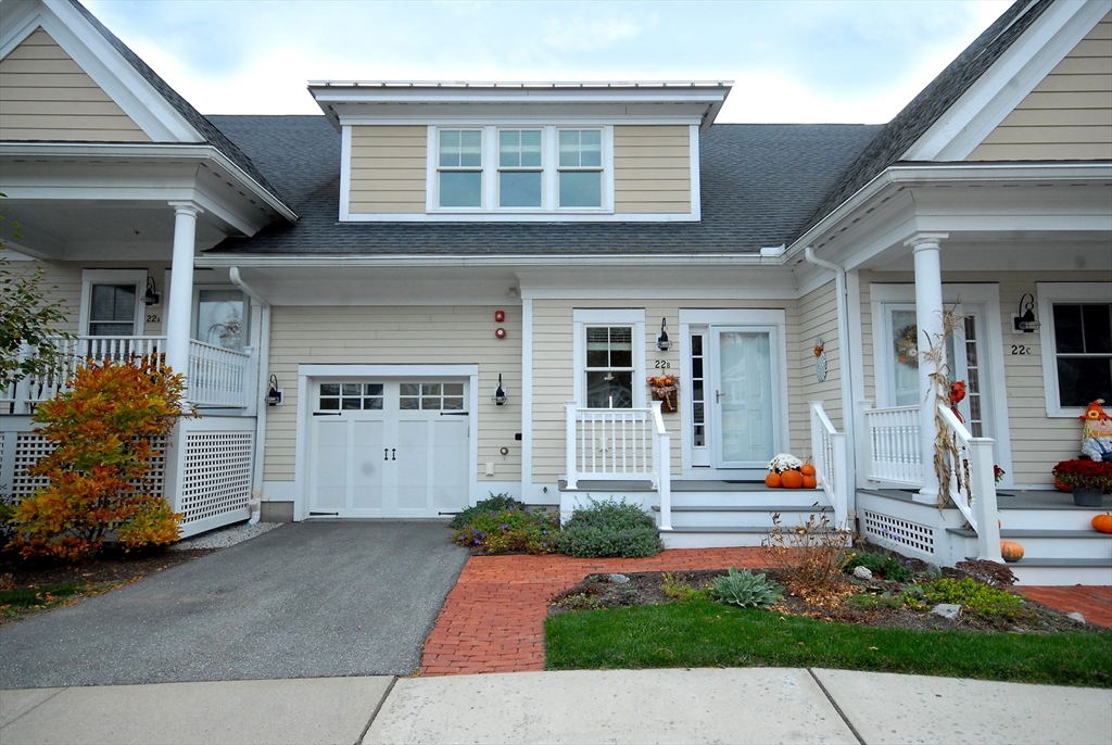 a front view of a house with a garage