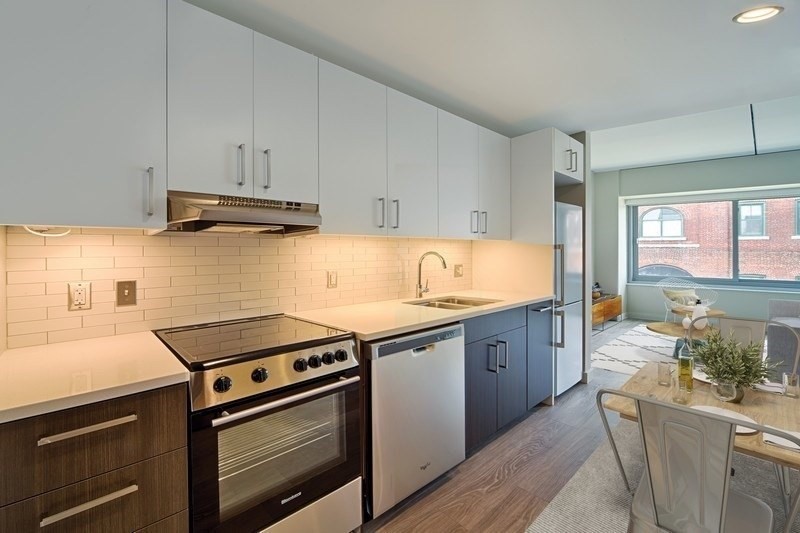 a kitchen with a stove and a sink