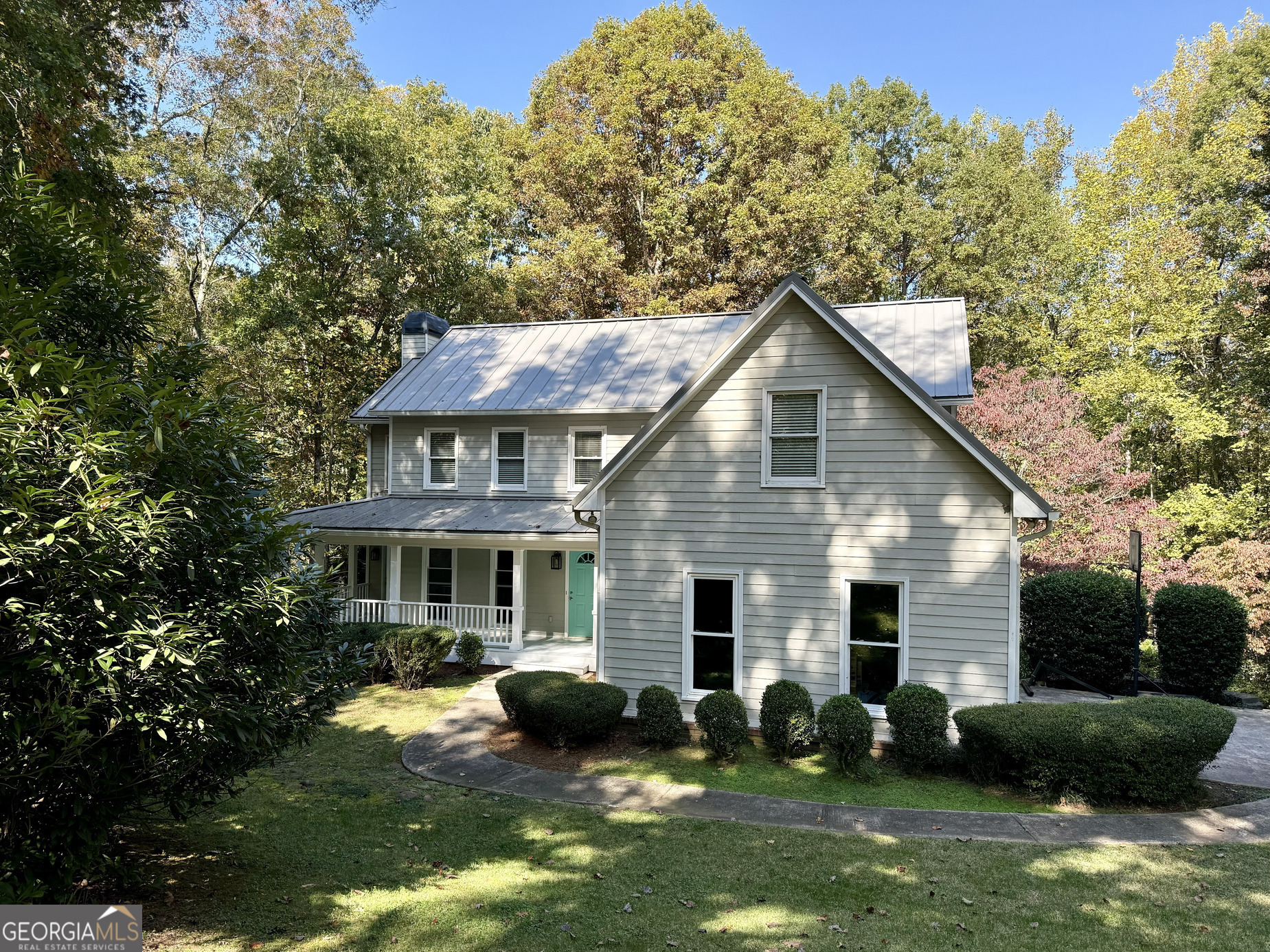 a view of house with yard