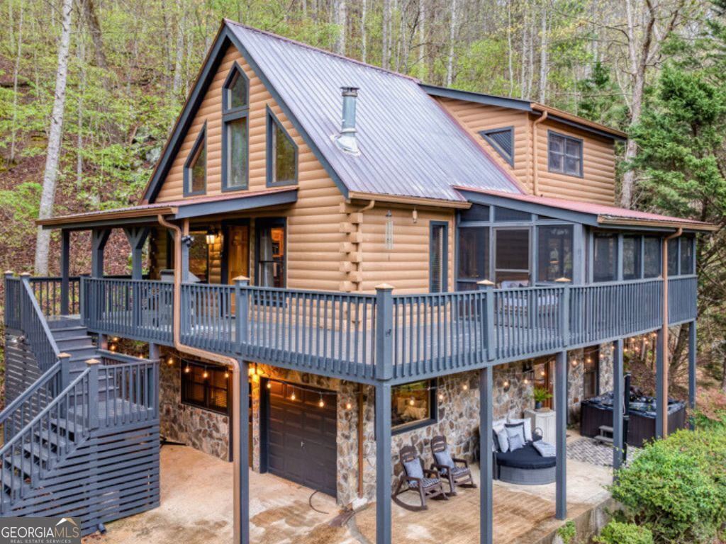 a view of a house with wooden deck