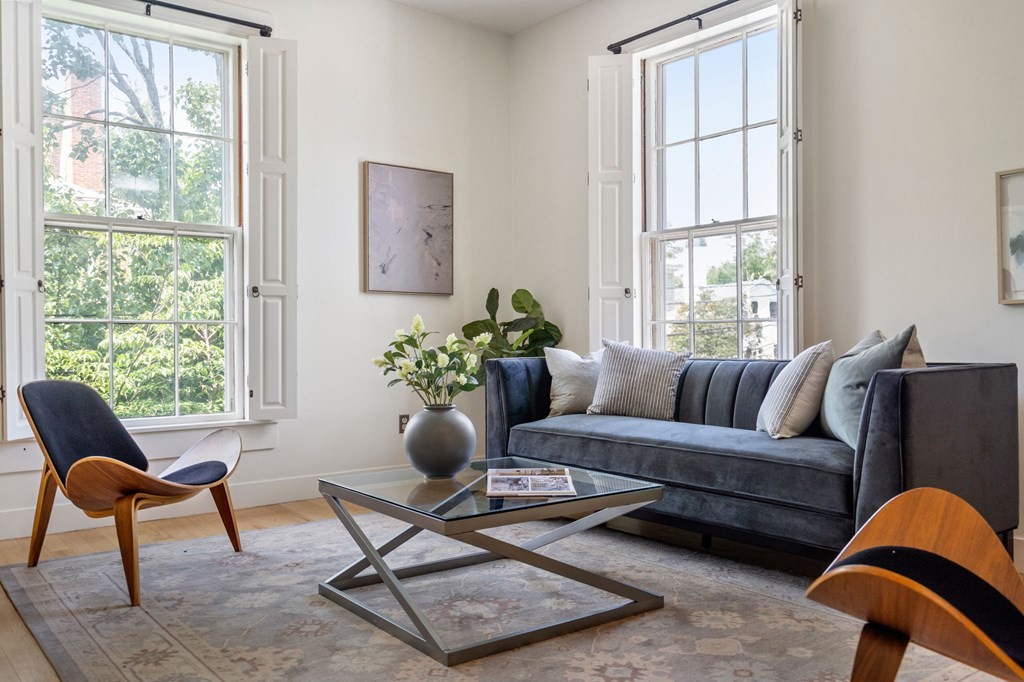 a living room with furniture and a window