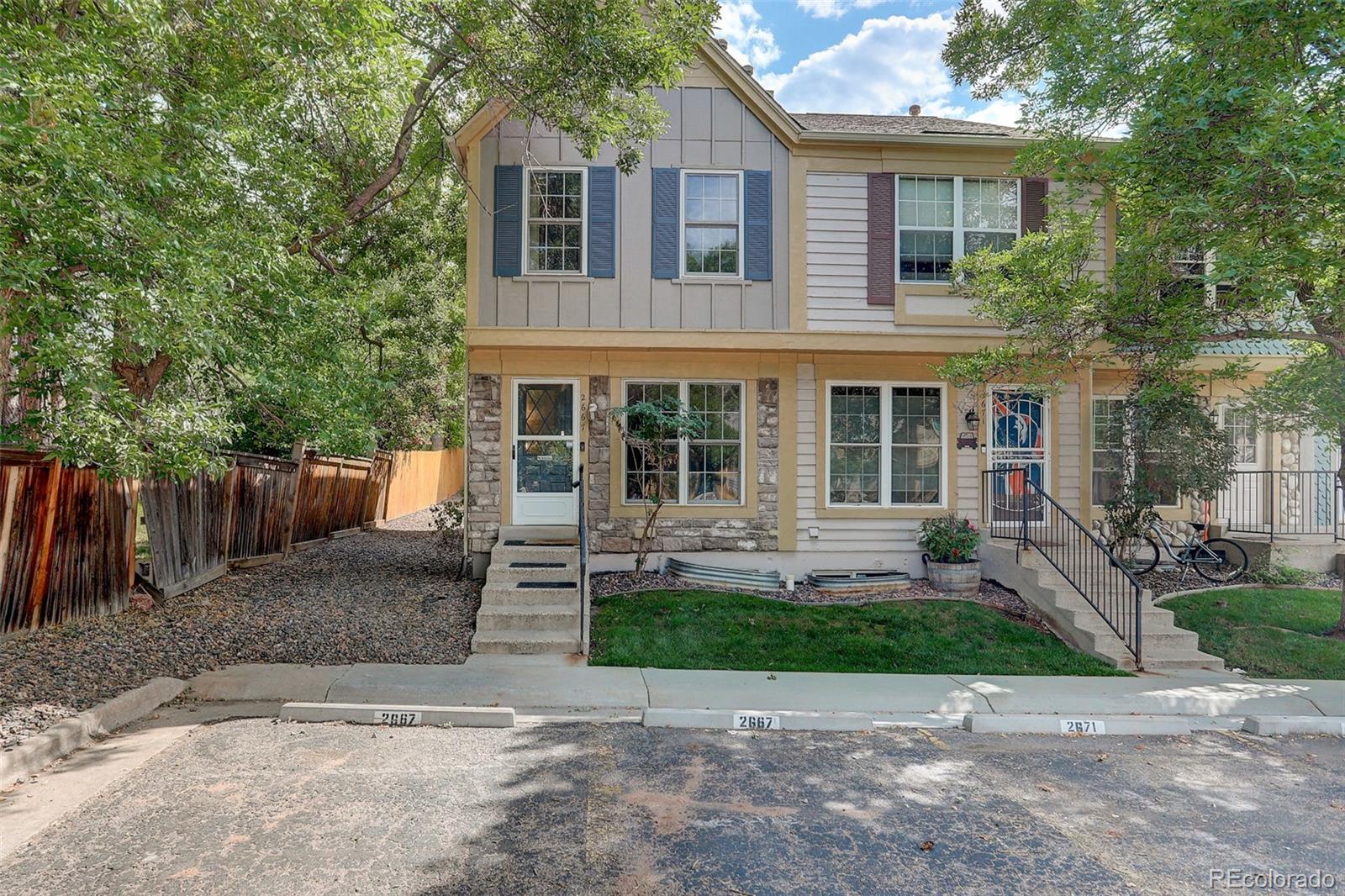 front view of a house with a yard