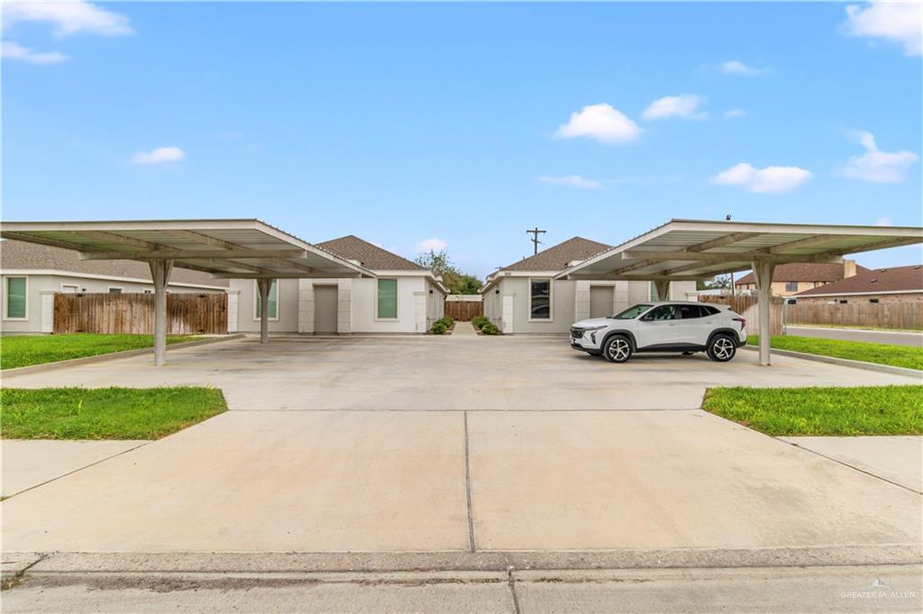 View of front of house with a carport