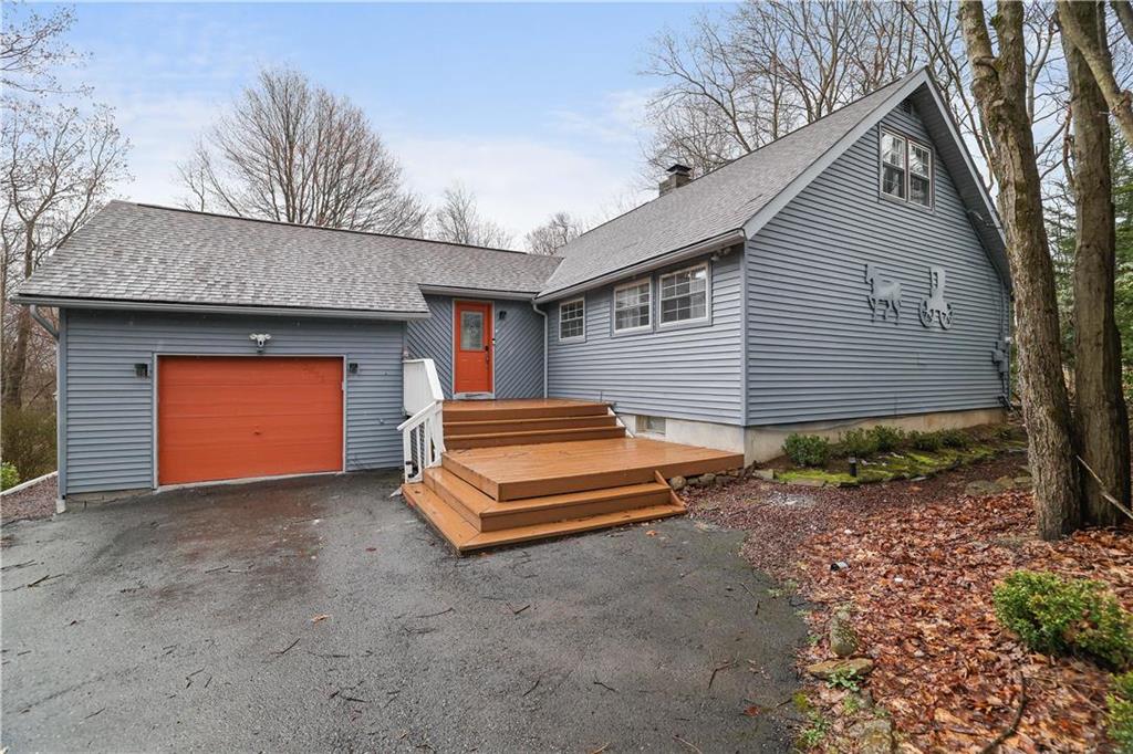 a front view of a house with a garage