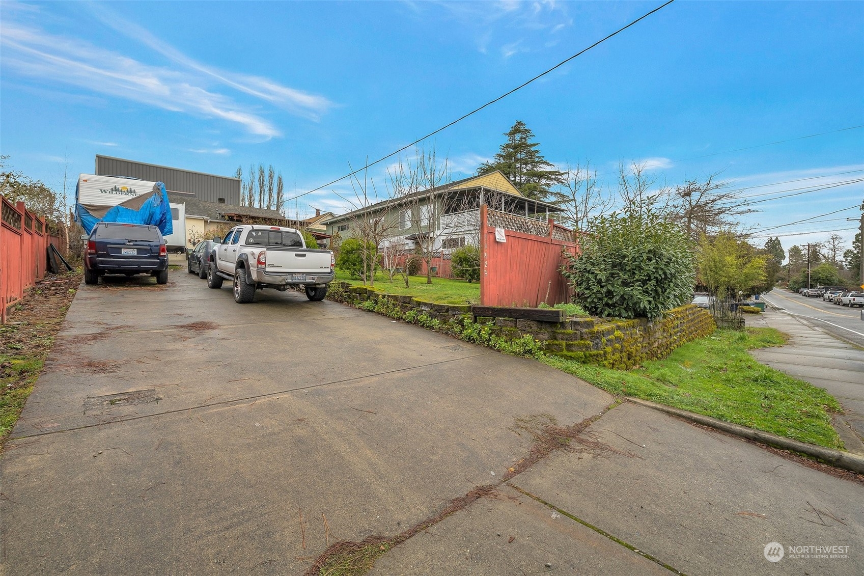 a view of a cars park in front of house