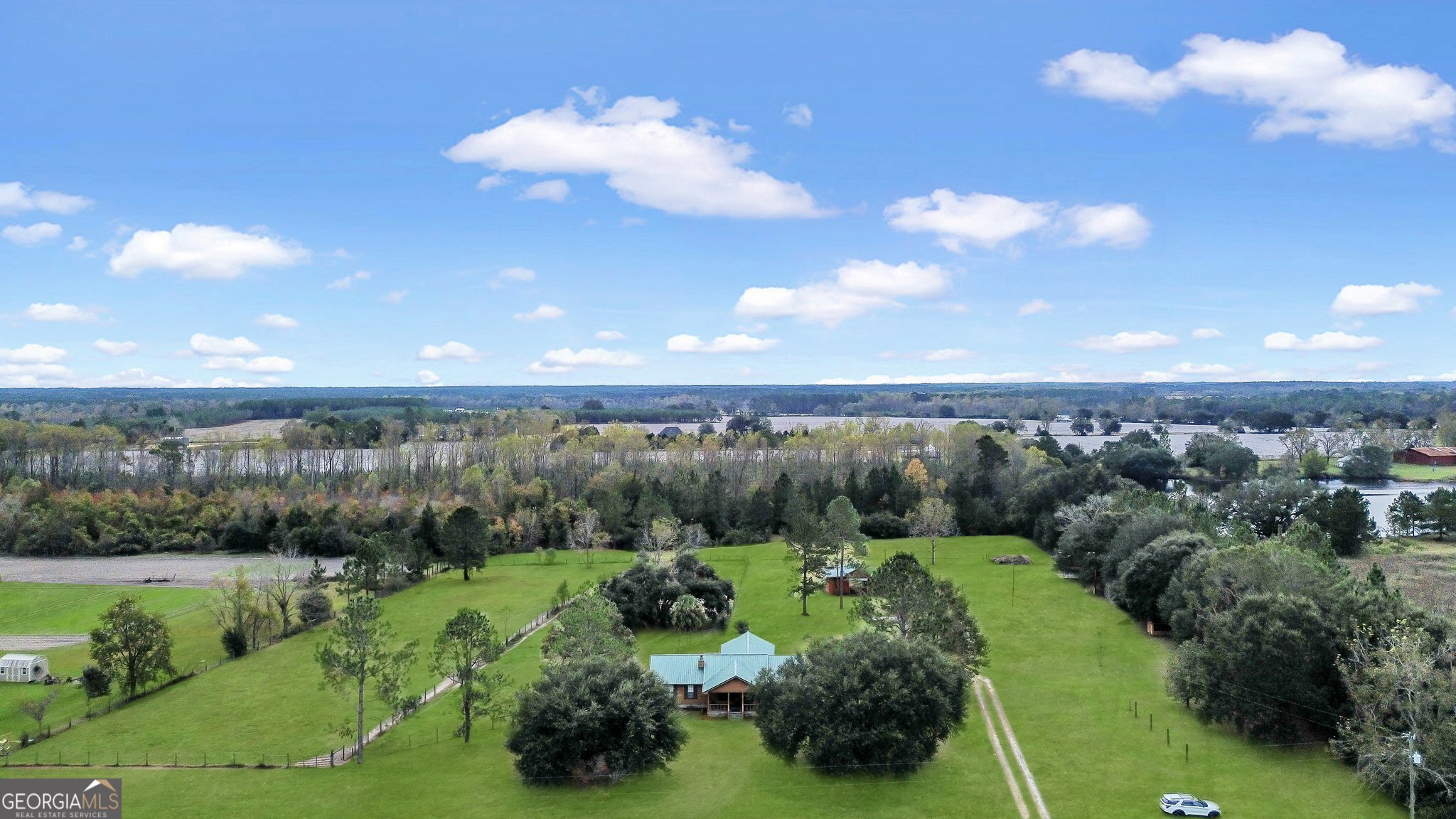 a view of a city with lush green forest