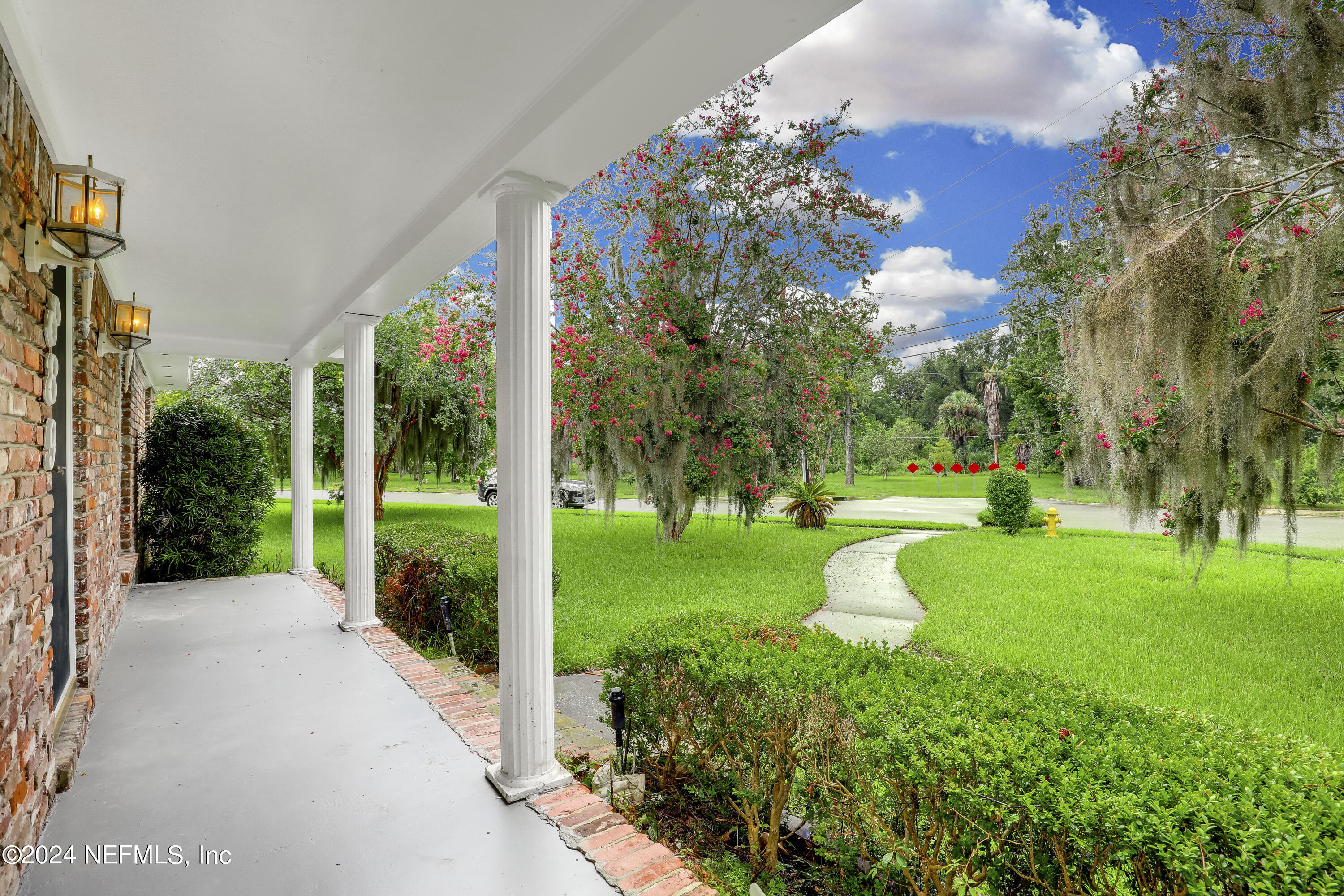 a view of a garden with a fountain