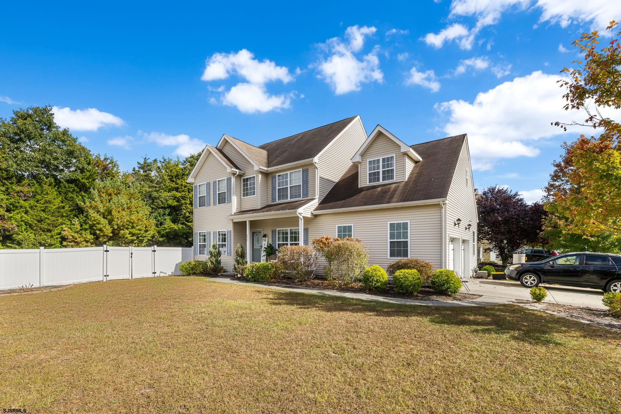 a front view of a house with a yard