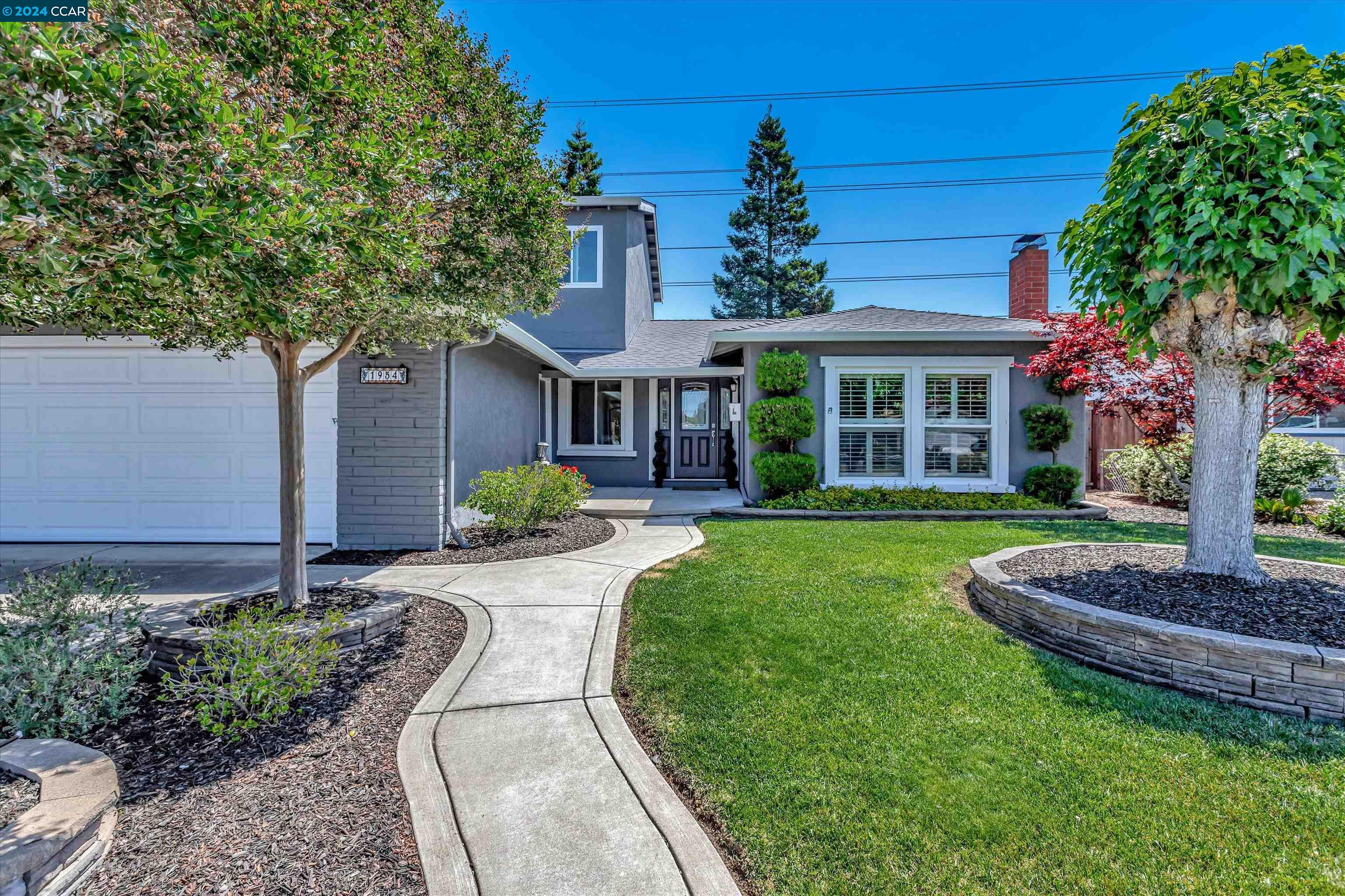 a house view with a garden space