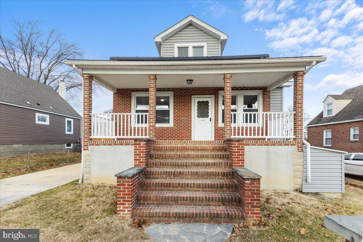 a front view of a house with a porch