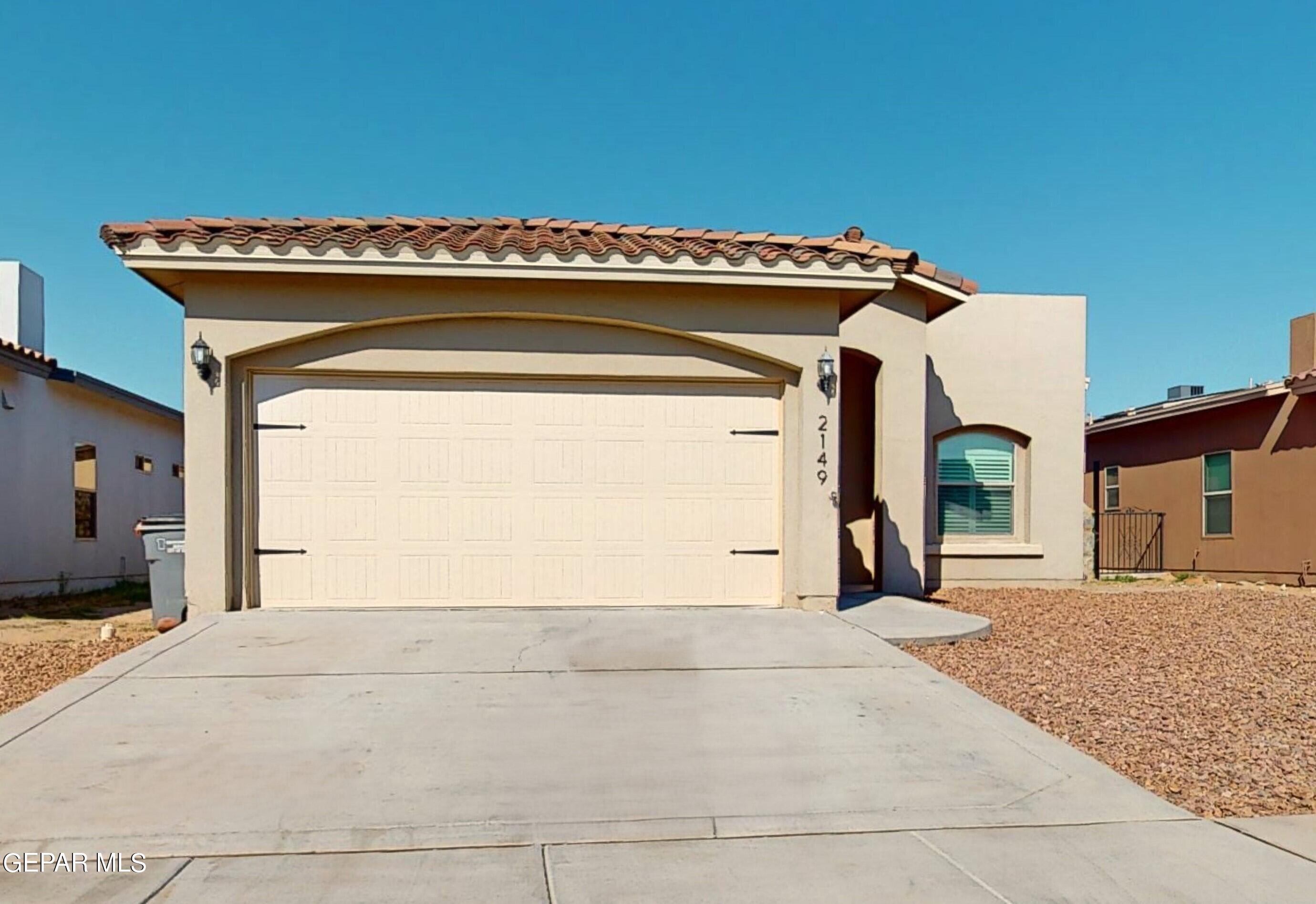 a view of a house with a garage