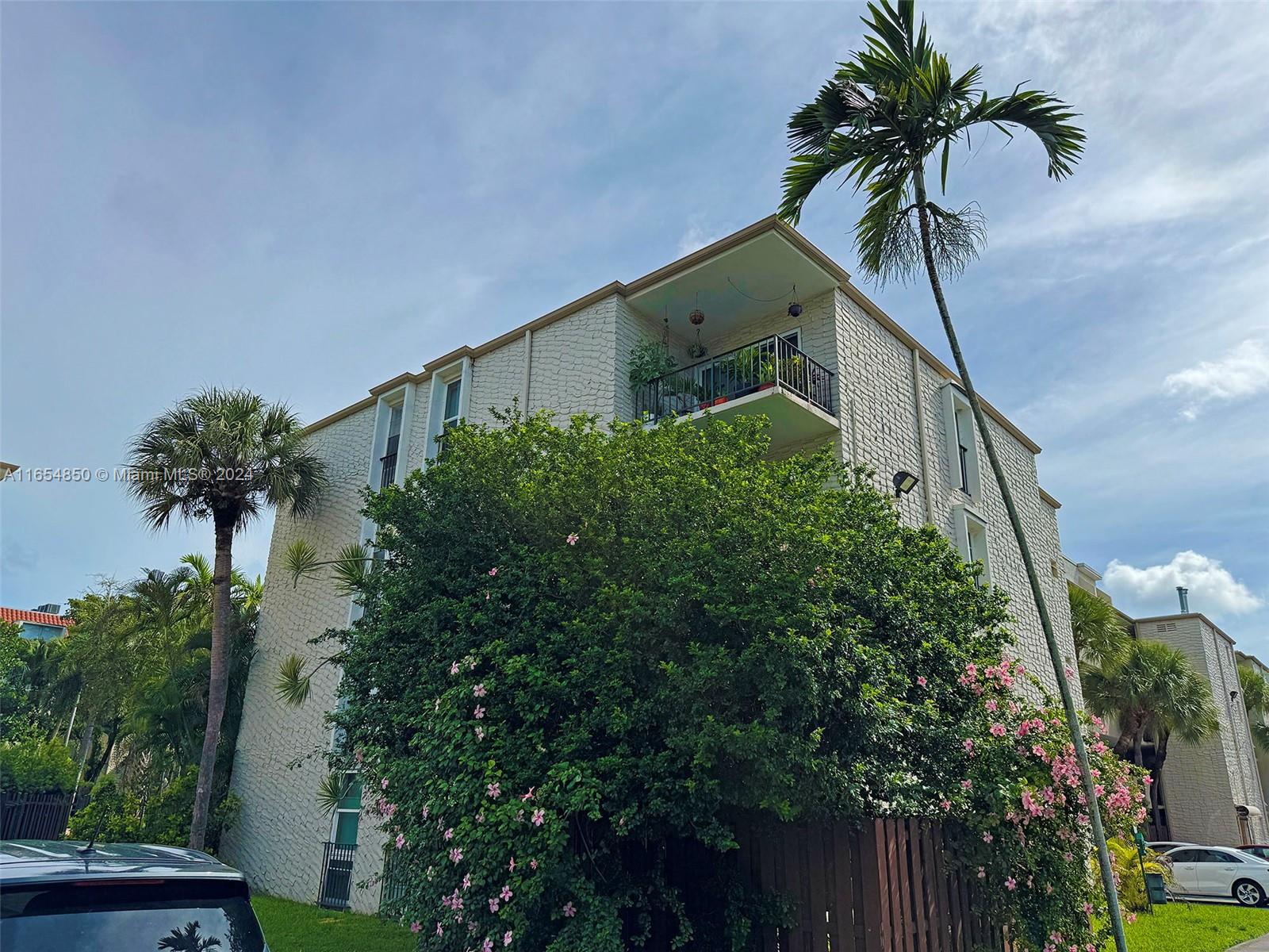 a view of balcony with a palm tree