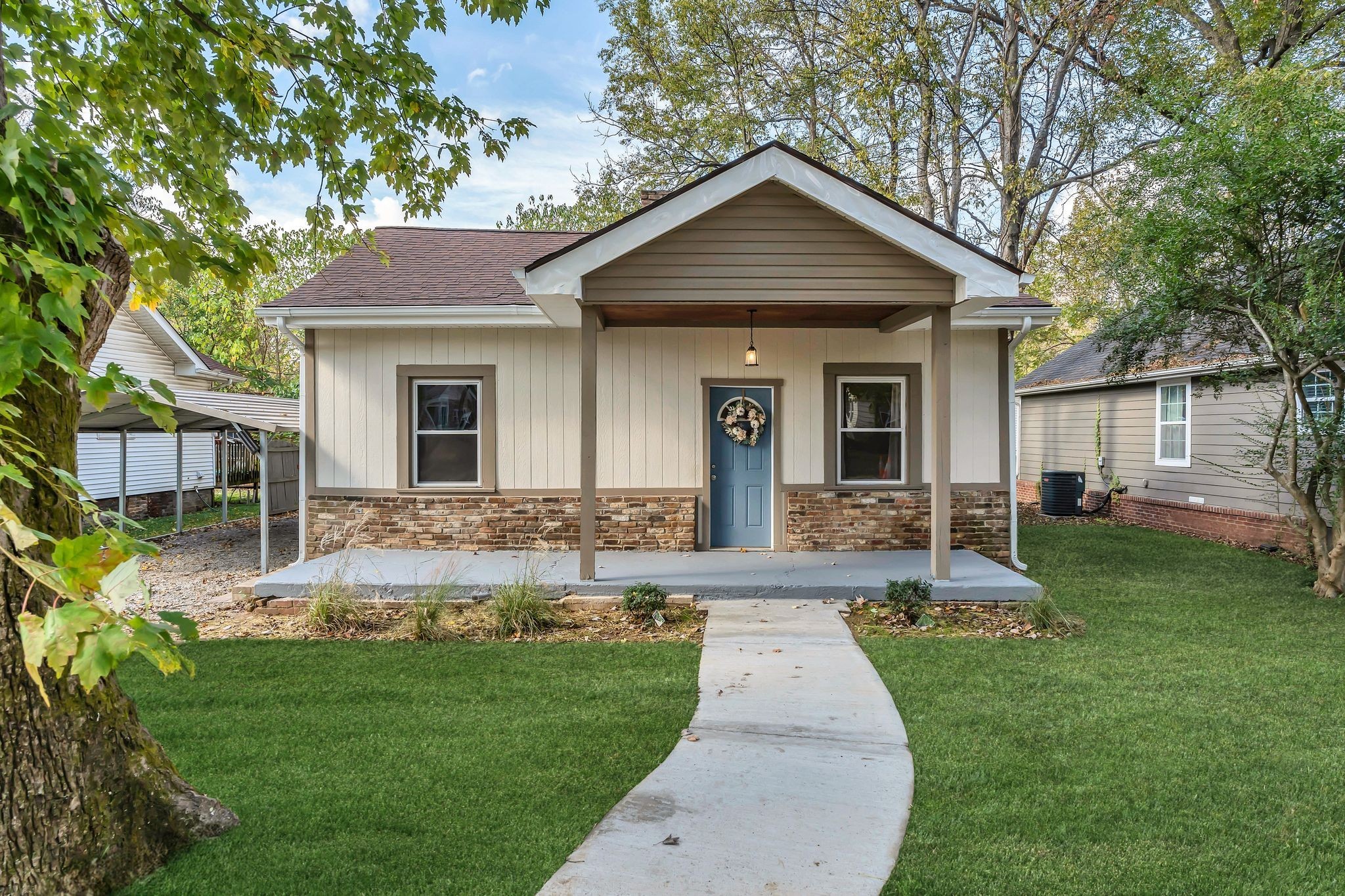 a front view of a house with a yard