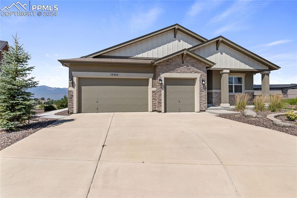 Craftsman-style home with a mountain view and oversize 3 car garage.