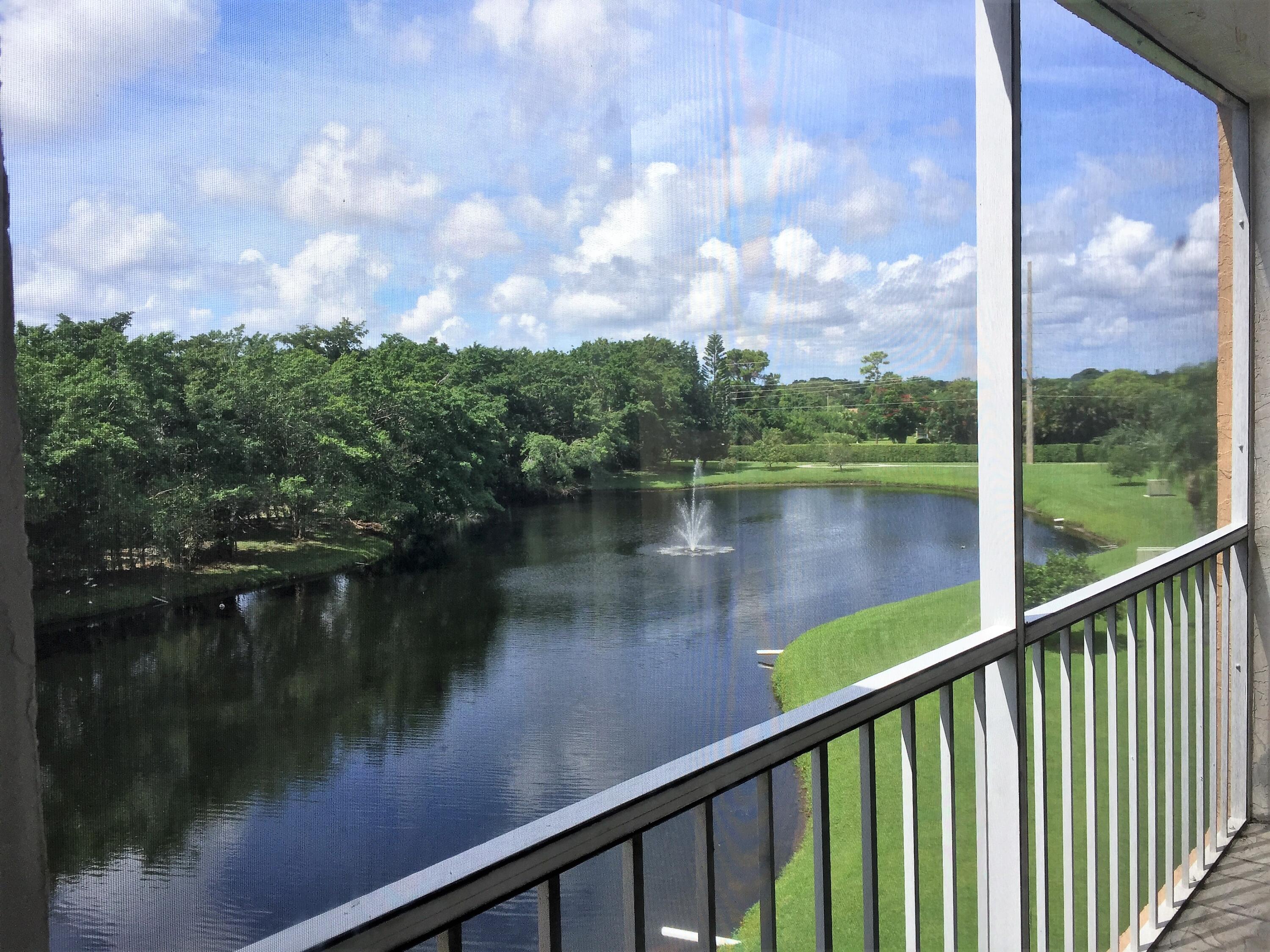 a view of a lake from a balcony