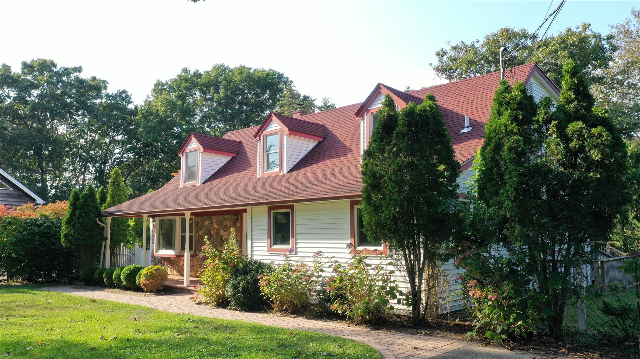 a front view of a house with garden