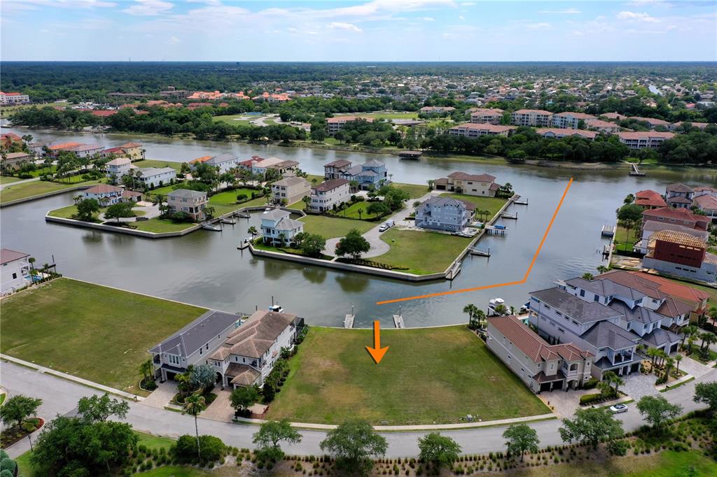 an aerial view of a house with a lake view