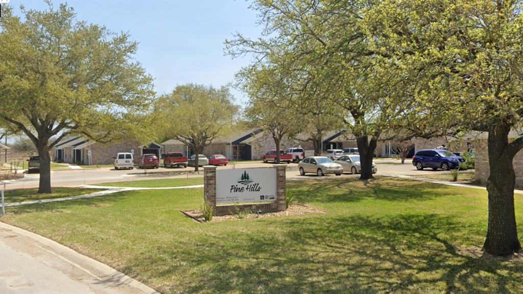 a view of a yard with swimming pool