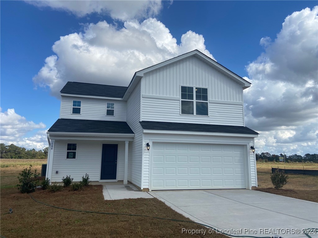 a front view of a house with a garage